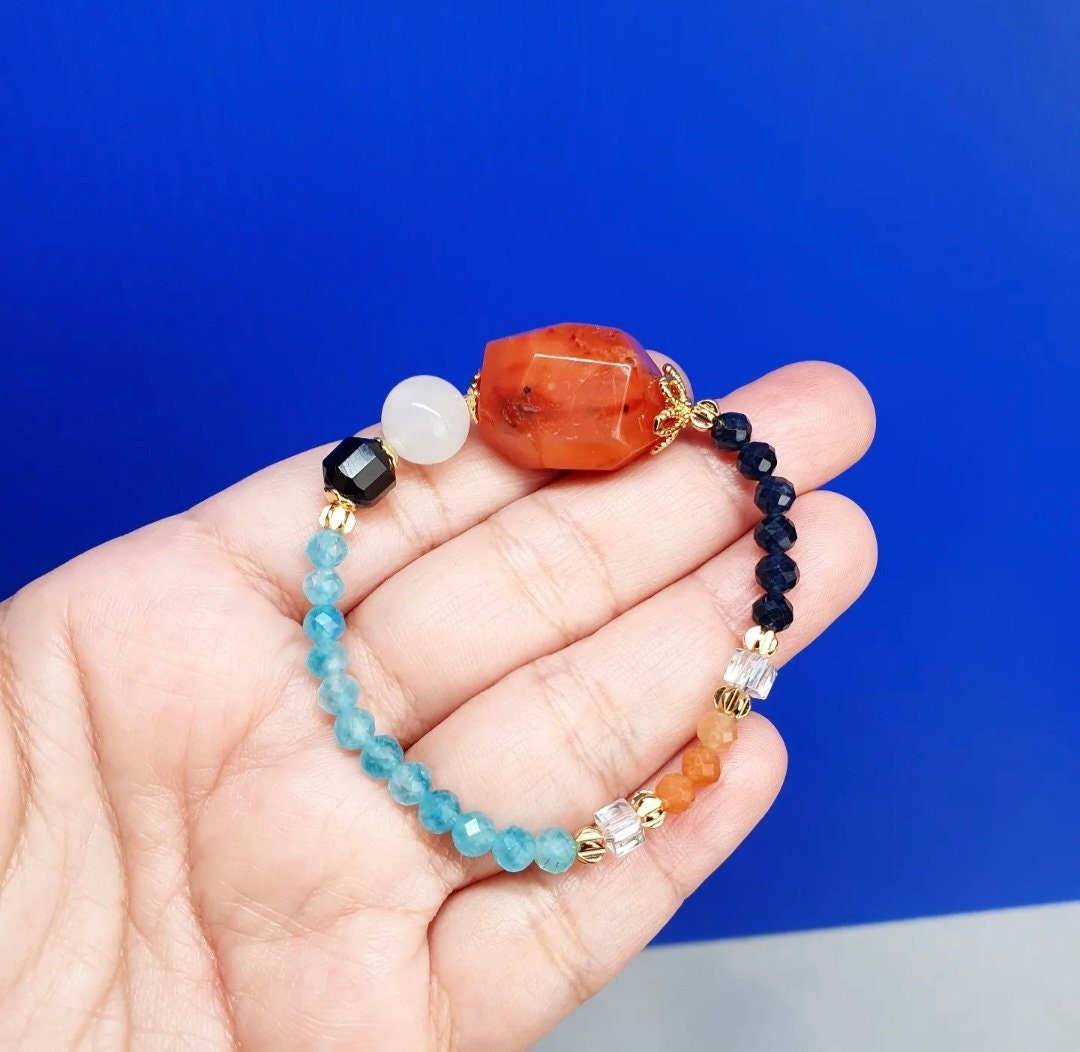 Handcrafted bracelet with Carnelian, Moonstone, Black Stripes Agate, Blue Chalcedony, Red Aventurine and Blue Sapphire