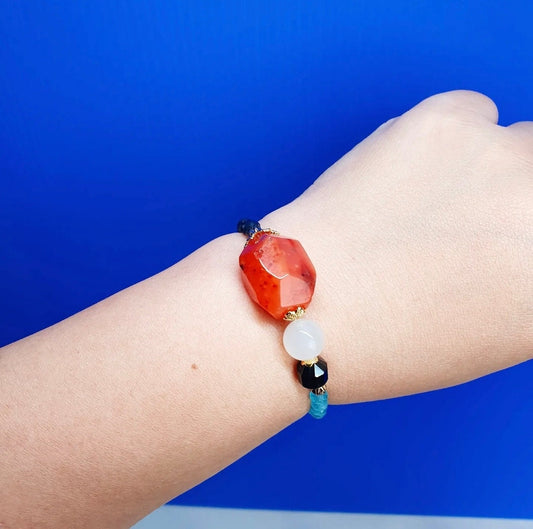 Handcrafted bracelet with Carnelian, Moonstone, Black Stripes Agate, Blue Chalcedony, Red Aventurine and Blue Sapphire