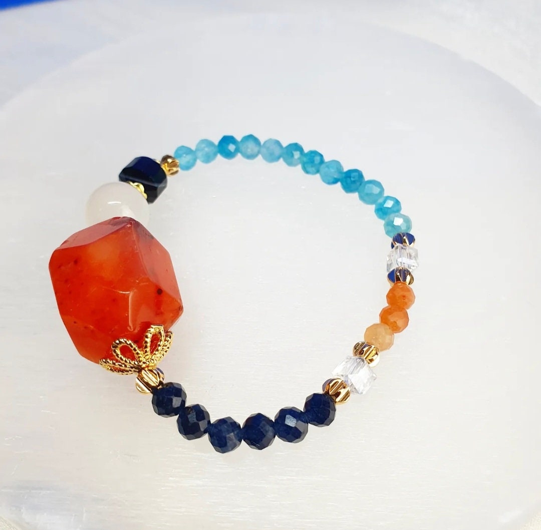 Handcrafted bracelet with Carnelian, Moonstone, Black Stripes Agate, Blue Chalcedony, Red Aventurine and Blue Sapphire