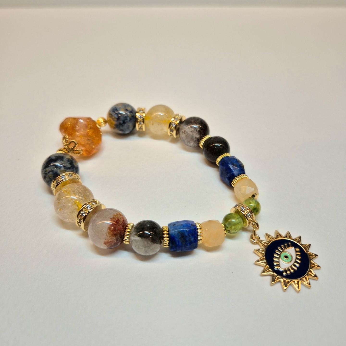 Handcrafted bracelet with Citrine, Marine agate, Gold rutilated quartz, Green phantom, Lapis lazuli, Yellow honey jade and Green peridot